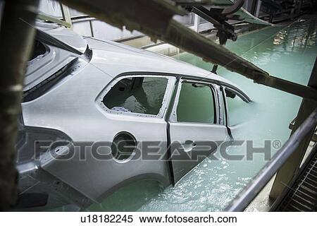 Car bodies being dipped in car factory View Large Photo Image Stock Photography - Car bodies being dipped in car factory. Fotosearch