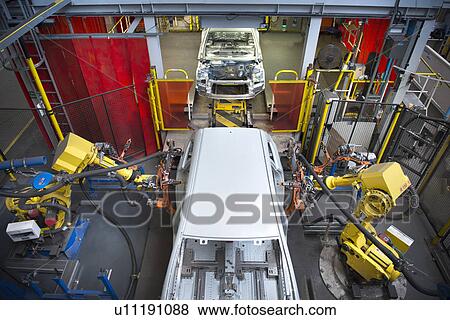 Stock Photo - Car bodies on measuring machine in car factory. Fotosearch