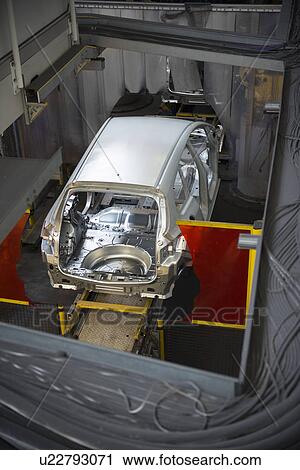 Stock Image - Car body on production line in car factory. Fotosearch