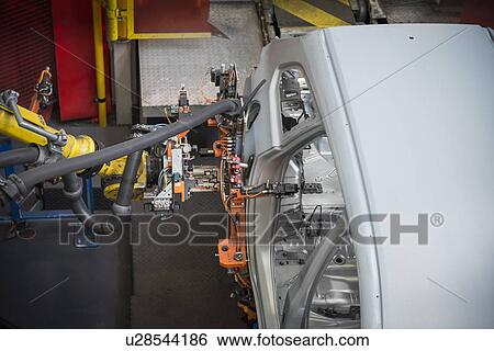 Stock Photograph - Car body on production line in car factory. Fotosearch