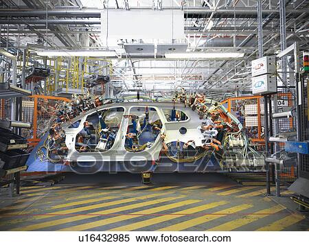 Stock Photography - Car body part in welding jig in car factory. Fotosearch