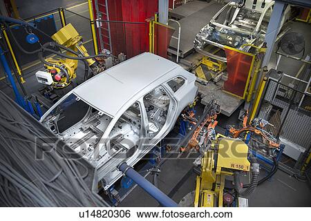 Car body with robots on production line in car factory View Large Photo Image Stock Photograph - Car body with robots on production line in car factory. Fotosearch