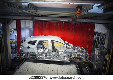 Car body with robots on production line in car factory View Large Photo Image Stock Photograph - Car body with robots on production line in car factory. Fotosearch