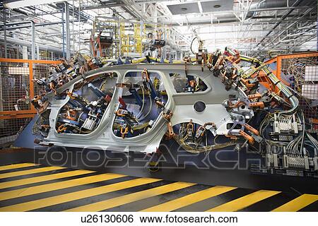 Stock Photograph - Car parts on welding jig in car factory. Fotosearch