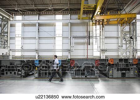 Car worker in press shop in car factory View Large Photo Image Stock Image - Car worker in press shop in car factory. Fotosearch