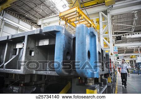 Car worker in press shop in car factory View Large Photo Image Stock Image - Car worker in press shop in car factory. Fotosearch