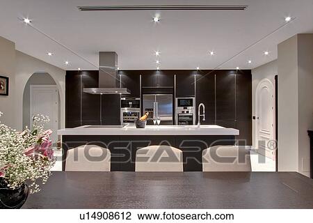 Champagne on ice in modern kitchen View Large Photo Image Stock Image - Champagne on ice in modern kitchen. Fotosearch