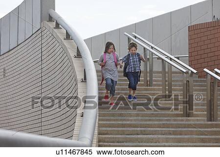 Stock Photography - Children climbing stairs outdoors. Fotosearch