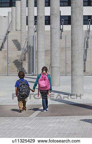 Children holding hands in courtyard View Large Photo Image Stock Photo - Children holding hands in courtyard. Fotosearch