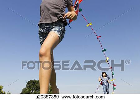 Children playing with kites outdoors View Large Photo Image Stock Photo - Children playing with kites outdoors. Fotosearch
