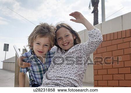 Children sliding down banister on steps View Large Photo Image Stock Photo - Children sliding down banister on steps. Fotosearch