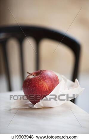 Close up of apple in paper bag View Large Photo Image Stock Photo - Close up of apple in paper bag. Fotosearch