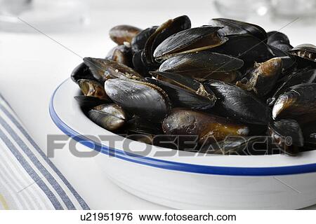 Stock Photograph - Close up of bowl of mussels. Fotosearch