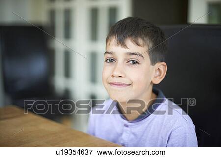 Stock Photo - Close up of boys smiling face. Fotosearch