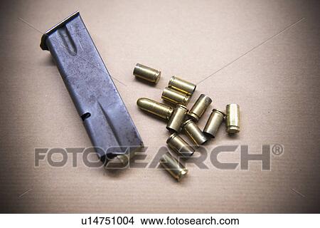 Close up of bullet casings and clip View Large Photo Image Picture - Close up of bullet casings and clip. Fotosearch