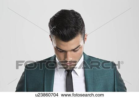 Picture - Close up of businessman looking down. Fotosearch