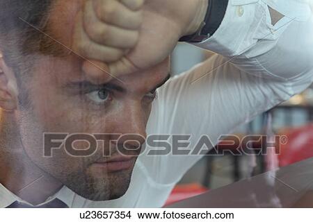 Close up of businessman thinking View Large Photo Image Picture - Close up of businessman thinking. Fotosearch