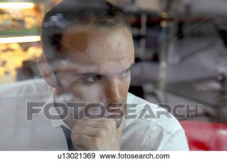 Close up of businessman thinking View Large Photo Image Stock Photo - Close up of businessman thinking. Fotosearch