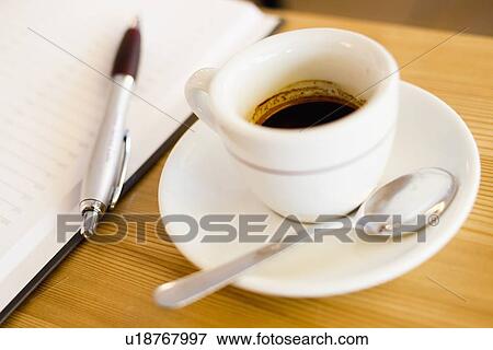 Close up of coffee cup, saucer and spoon View Large Photo Image Stock Photo - Close up of coffee cup, saucer and spoon. Fotosearch