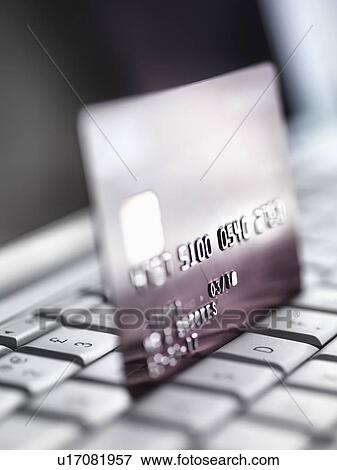 Stock Photo - Close up of credit card on keyboard. Fotosearch