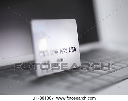 Close up of credit card on keyboard View Large Photo Image Stock Photo - Close up of credit card on keyboard. Fotosearch
