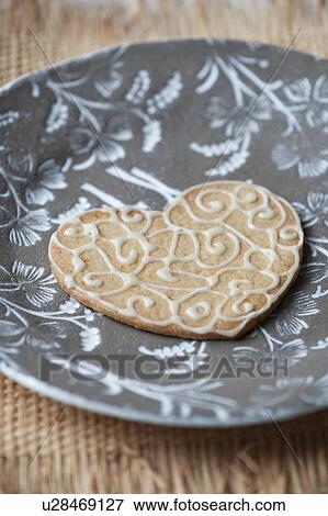 Stock Photo - Close up of decorated cookie on plate. Fotosearch