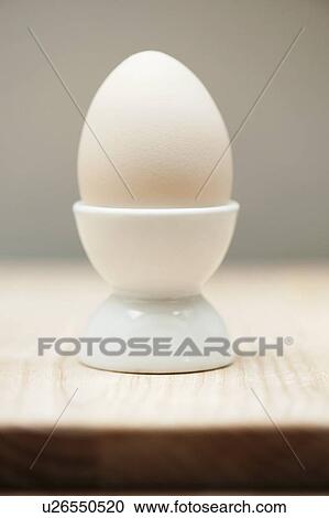 Close up of egg in egg cup View Large Photo Image Stock Image - Close up of egg in egg cup. Fotosearch