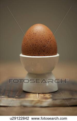 Close up of egg in egg cup View Large Photo Image Stock Image - Close up of egg in egg cup. Fotosearch