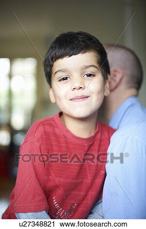 Close up of father carrying son View Large Photo Image Stock Image - Close up of father carrying son. Fotosearch