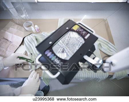 Stock Photo - Close up of fibers in forensic lab. Fotosearch
