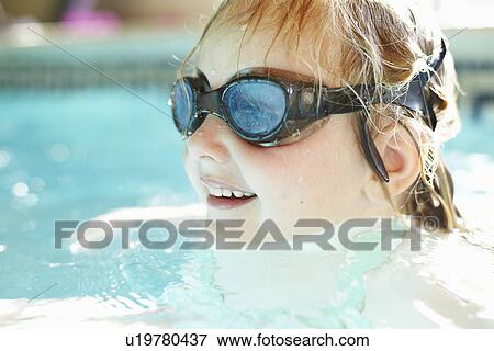 Stock Photo - Close up of girl swimming in pool. Fotosearch