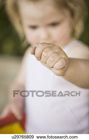 Stock Photo - Close up of girls closed fist. Fotosearch