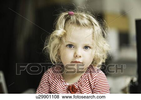 Close up of girls curious face View Large Photo Image Stock Photo - Close up of girls curious face. Fotosearch