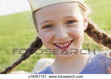 Stock Image - Close up of girls smiling face. Fotosearch