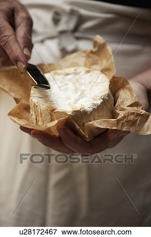 Close up of man slicing cheese View Large Photo Image Stock Photo - Close up of man slicing cheese. Fotosearch
