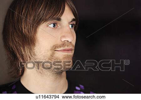 Picture - Close up of mans smiling face. Fotosearch