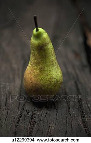 Picture - Close up of pear on table. Fotosearch