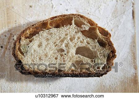 Stock Photo - Close up of sliced loaf of bread. Fotosearch