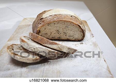 Close up of sliced loaf of bread View Large Photo Image Stock Photo - Close up of sliced loaf of bread. Fotosearch