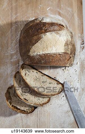 Close up of sliced loaf of bread View Large Photo Image Stock Photo - Close up of sliced loaf of bread. Fotosearch