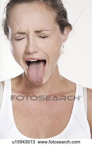 Close up of woman grimacing View Large Photo Image Stock Image - Close up of woman grimacing. Fotosearch
