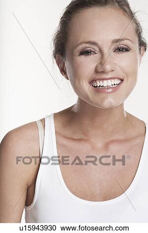 Stock Image - Close up of womans smiling face. Fotosearch