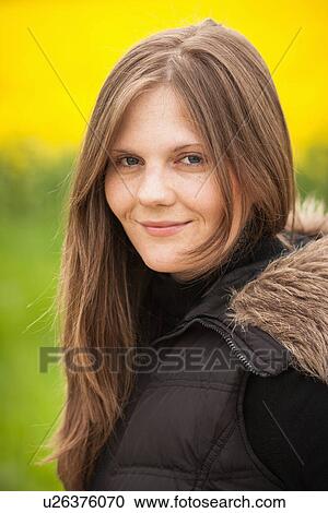 Stock Image - Close up of womans smiling face. Fotosearch