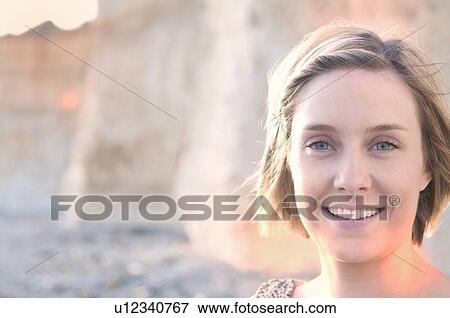 Stock Photo - Close up of womans smiling face. Fotosearch