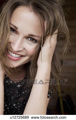 Stock Photo - Close up of womans smiling face. Fotosearch