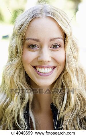 Close up of womans smiling face View Large Photo Image Stock Photo - Close up of womans smiling face. Fotosearch