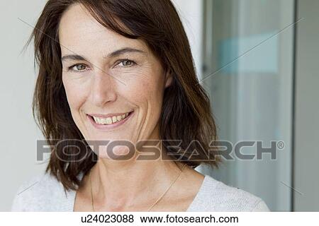 Stock Photo - Close up of womans smiling face. Fotosearch