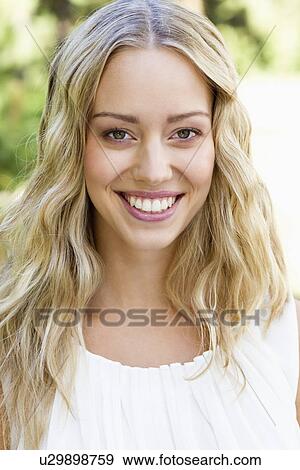 Close up of womans smiling face View Large Photo Image Stock Photo - Close up of womans smiling face. Fotosearch