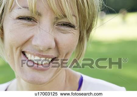 Close up of womans smiling face View Large Photo Image Stock Photography - Close up of womans smiling face. Fotosearch