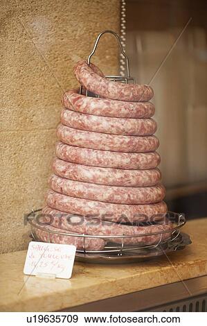 Stock Photo - Coiled sausage in butchers shop. Fotosearch